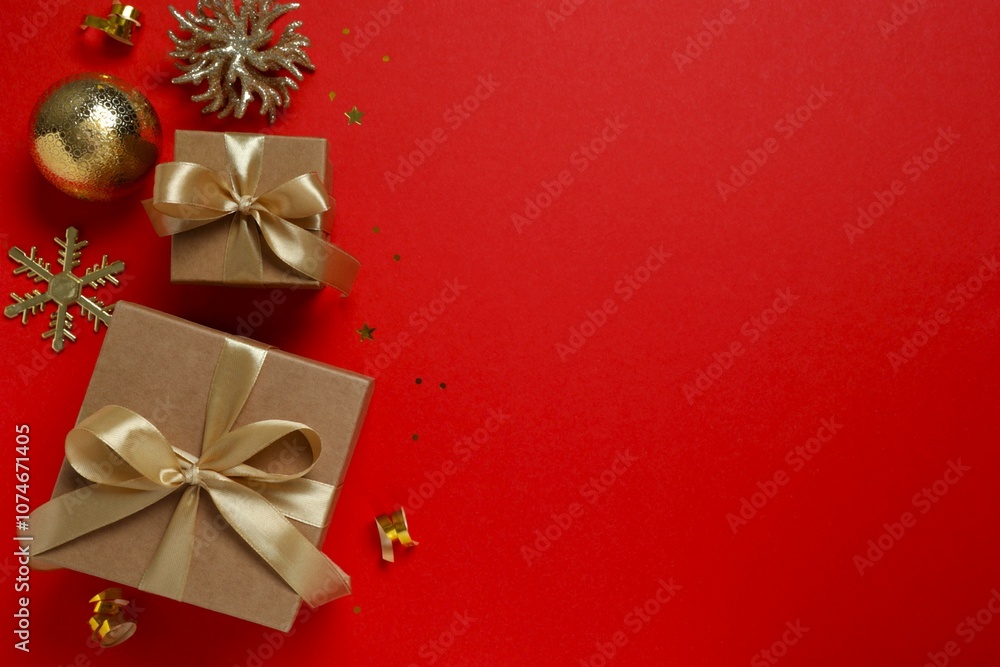 Beautiful gift boxes tied with bows and Christmas decorations on color background Beautiful gift boxes tied with bows and Christmas decorations on color background