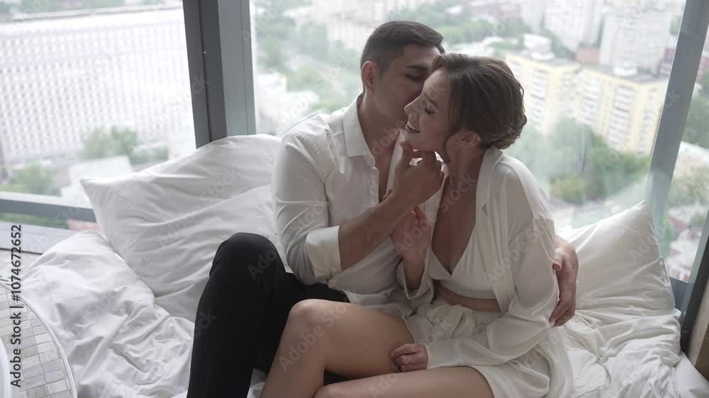 A Beautiful Romantic Moment A Cozy Couple in Bed Enjoying an Inspiring City View Together A Beautiful Romantic Moment A Cozy Couple in Bed Enjoying an Inspiring City View Together