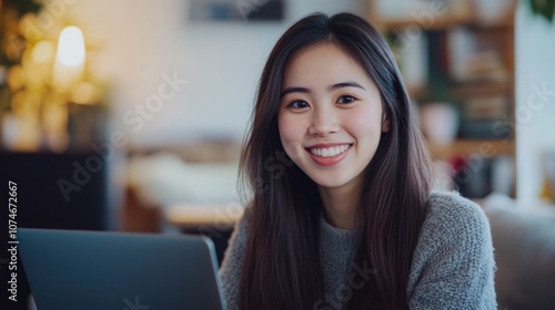 Portrait photography of a beautiful Asian girl talking online through a computer.