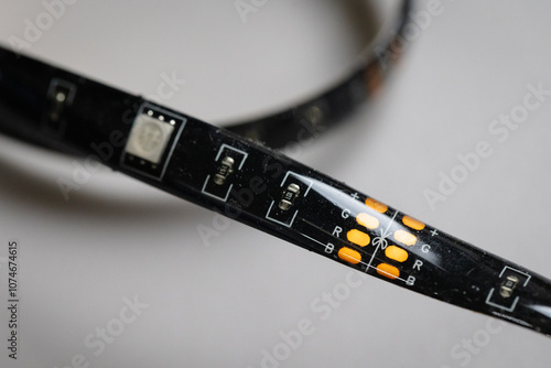 Close up on a RGB LED environmental proof strip showing cutting point and components on a LED light strip. RGB colour options, leds and electronics 