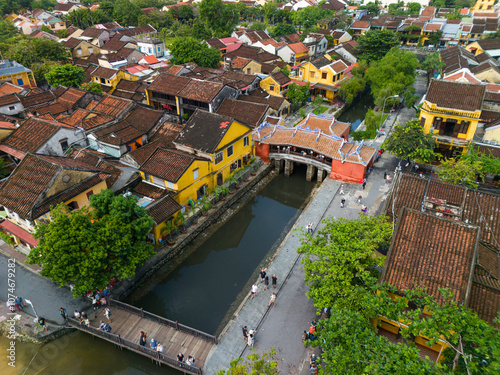 Wallpaper Mural Aerial view of Chua Cau or Japanese Covered ancient Bridge and River in Old city of Hoi An, Vietnam. Vietnamese heritage and culture in Hoian ancient town Torontodigital.ca