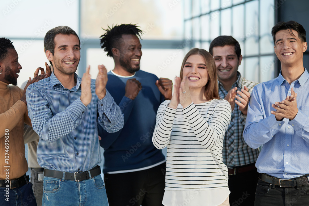 Obraz premium Human resources. Group portrait of smiling employees of a friendly team of different racial genders standing together in an office.