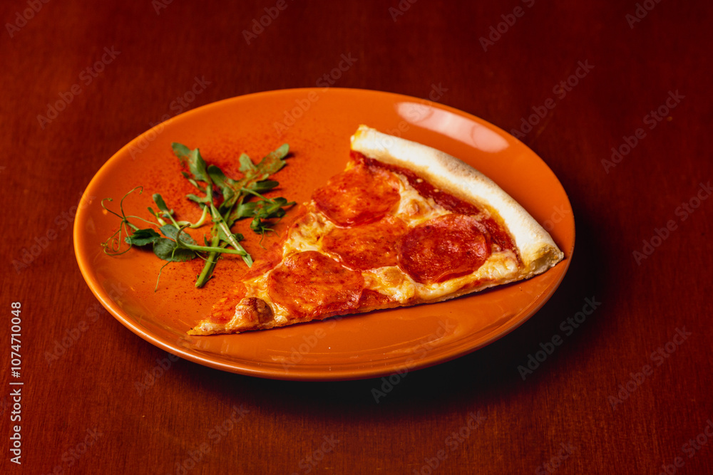 Slice of pepperoni pizza on plate on wooden background Slice of pepperoni pizza on plate on wooden background