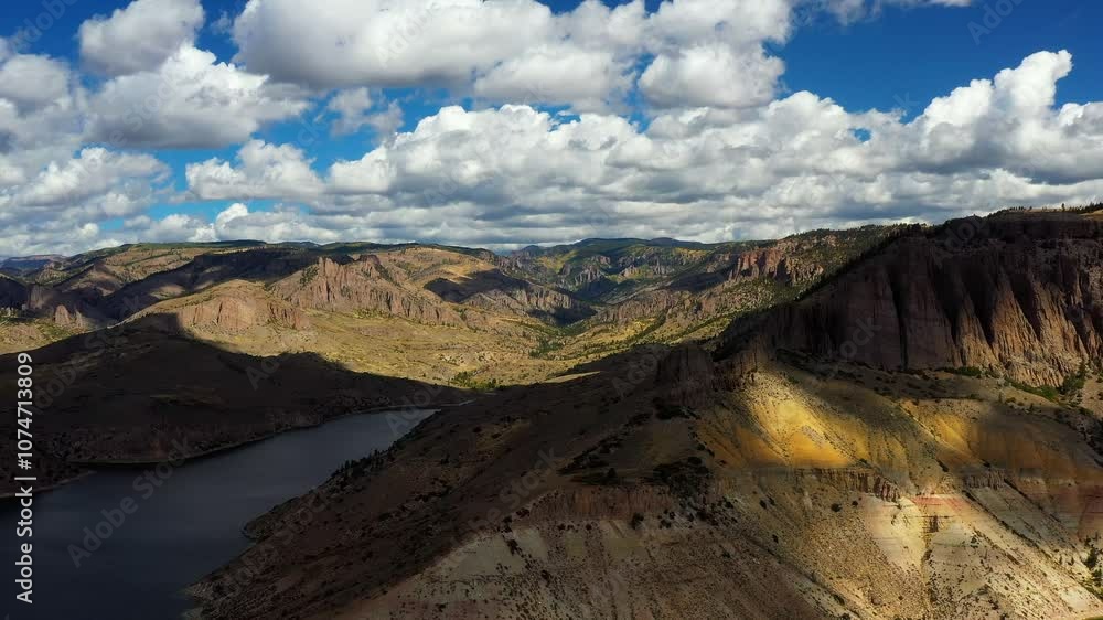 Scenic high flying shot of mountains, lake, and landscape in Colorado Scenic high flying shot of mountains, lake, and landscape in Colorado