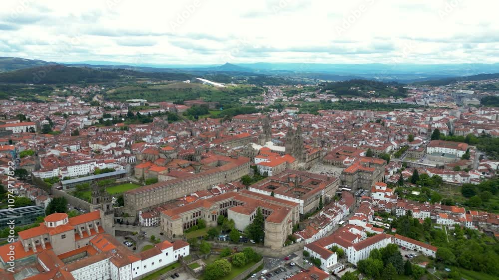 Panoramic aerial view of Santiago de Compostela city. Cathedral of Santiago. The cathedral is the reputed burial place of Saint James the Great, one of the apostles of Jesus Christ. Travel destination Panoramic aerial view of Santiago de Compostela city. Cathedral of Santiago. The cathedral is the reputed burial place of Saint James the Great, one of the apostles of Jesus Christ. Travel destination