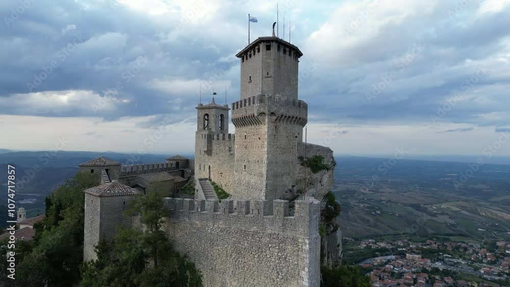 drone close up to one of the The Three Towers of San Marino group of fortress medieval castle located on the three peaks of Monte Titano in the capital of republic San Marino in Italy micro state drone close up to one of the The Three Towers of San Marino group of fortress medieval castle located on the three peaks of Monte Titano in the capital of republic San Marino in Italy micro state