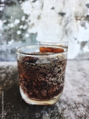 Cola drink with ice cubes