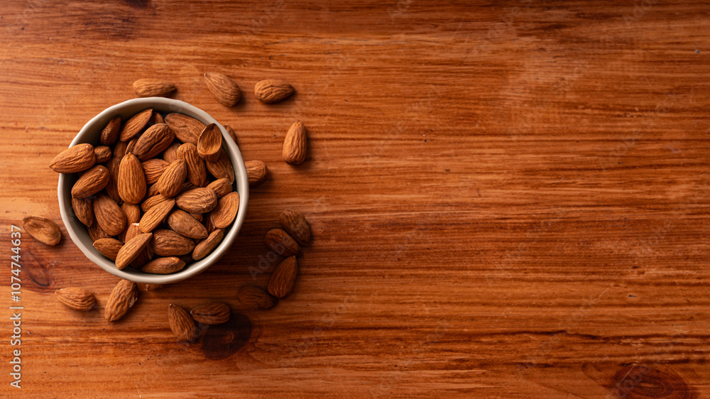 Fresh organic almonds white ceramic bowl wooden table healthy natural snack nutrition food Fresh organic almonds white ceramic bowl wooden table healthy natural snack nutrition food