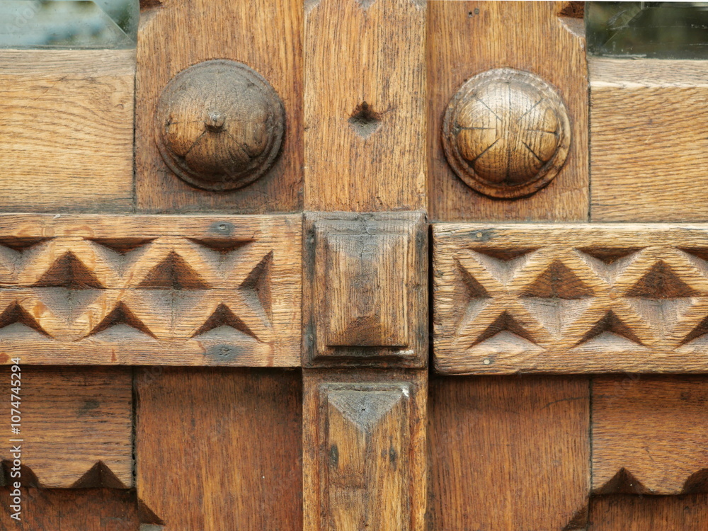 detailed view of a highly ornate wooden door showcases intricate carvings and traditional craftsmanship, reflecting historical woodwork. detailed view of a highly ornate wooden door showcases intricate carvings and traditional craftsmanship, reflecting historical woodwork.