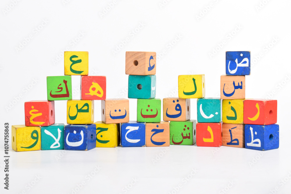 Wooden Arabic Alphabet Blocks isolated on white background. Arabic Alphabet Cubes. Preschool and education concept. Copy space Wooden Arabic Alphabet Blocks isolated on white background. Arabic Alphabet Cubes. Preschool and education concept. Copy space