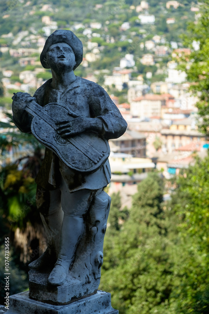 Statue of a musician in the garden of Villa Durazzo in Santa Margherita Ligure, Italy Statue of a musician in the garden of Villa Durazzo in Santa Margherita Ligure, Italy