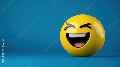 A cheerful yellow emoticon with a wide grin and a winking eye stands out against a calming blue background, perfect for conveying joy and positivity in various creative projects.