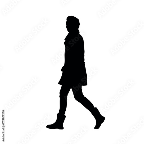 Obraz na płótnie a silhouette of a person walking in a stylish trench coat and boots w salonie