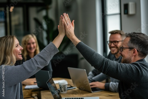 Meeting, group and thumbs up in negotiation, office and agreement of merger of company and unity. Cooperation, celebration, deal and coalition for politics in Germany, government or yes in business photo