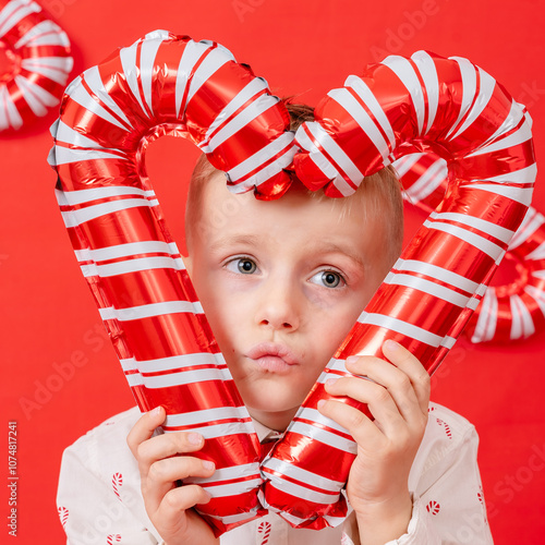 New Year's Eve shoot of a little boy with New Year's Eve decorations of inflatable lollipops photo