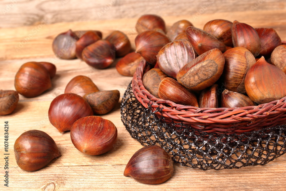 Group of raw chestnuts arranged on wooden boards. Group of raw chestnuts arranged on wooden boards.