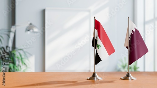 FLAGS OF IRAQ AND QATAR ON TABLE photo