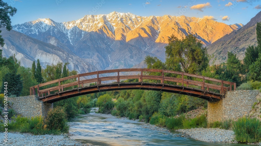 Scenic view of a wooden bridge over a river with mountains in the background. Scenic view of a wooden bridge over a river with mountains in the background.