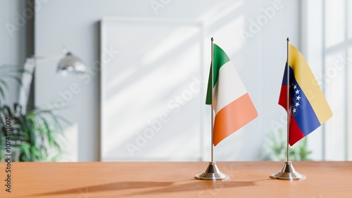 FLAGS OF IRELAND AND VENEZUELA ON TABLE photo