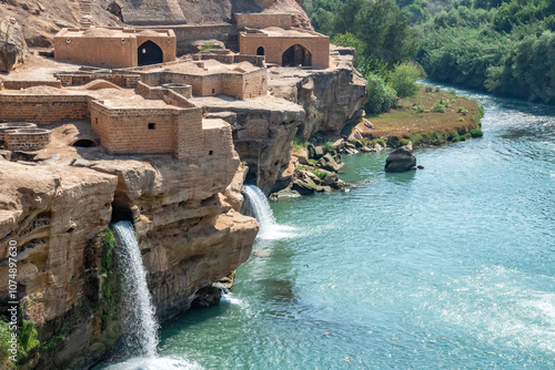 A waterfall is beautifully surrounded by a body of water, Shushtar, Iran photo