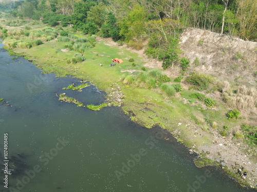 Scenic Aerial View of Lush River Valley Landscape in Spring