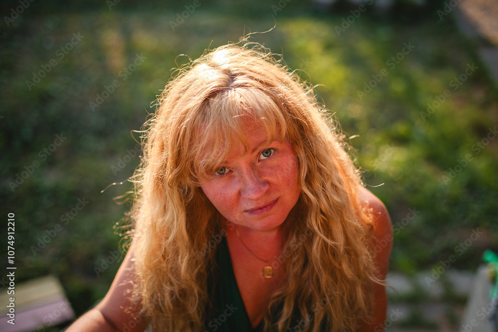A portrait of a Slavic woman with light golden hair glistening in the sunlight, her expression serene and radiant. A portrait of a Slavic woman with light golden hair glistening in the sunlight, her expression serene and radiant.