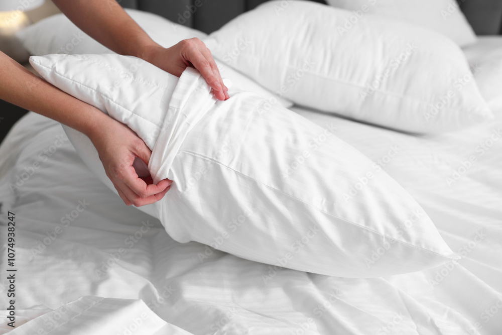 Woman changing clean bed linens at home, closeup Woman changing clean bed linens at home, closeup