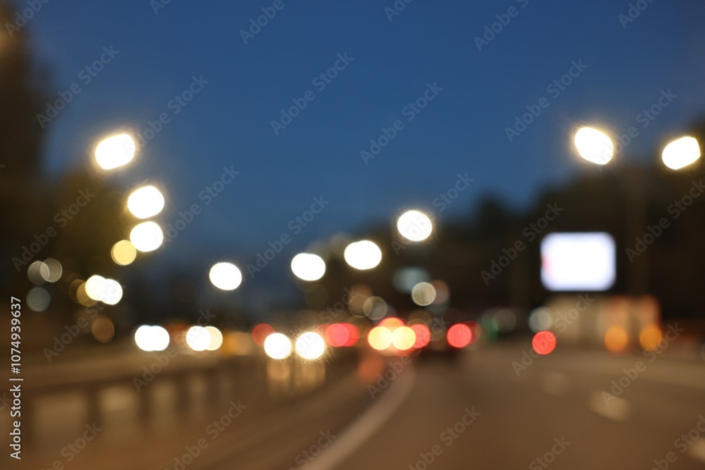 Blurred view of cityscape with road traffic and street lights in evening Blurred view of cityscape with road traffic and street lights in evening