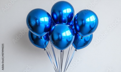 blue and gray balloons paety on white background, high resolution photography, studio lighting photo