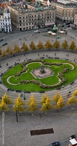 Aerial drone view of the Kongens Nytorv public square in Copenhagen, Denmark in daylight. Vertical photo