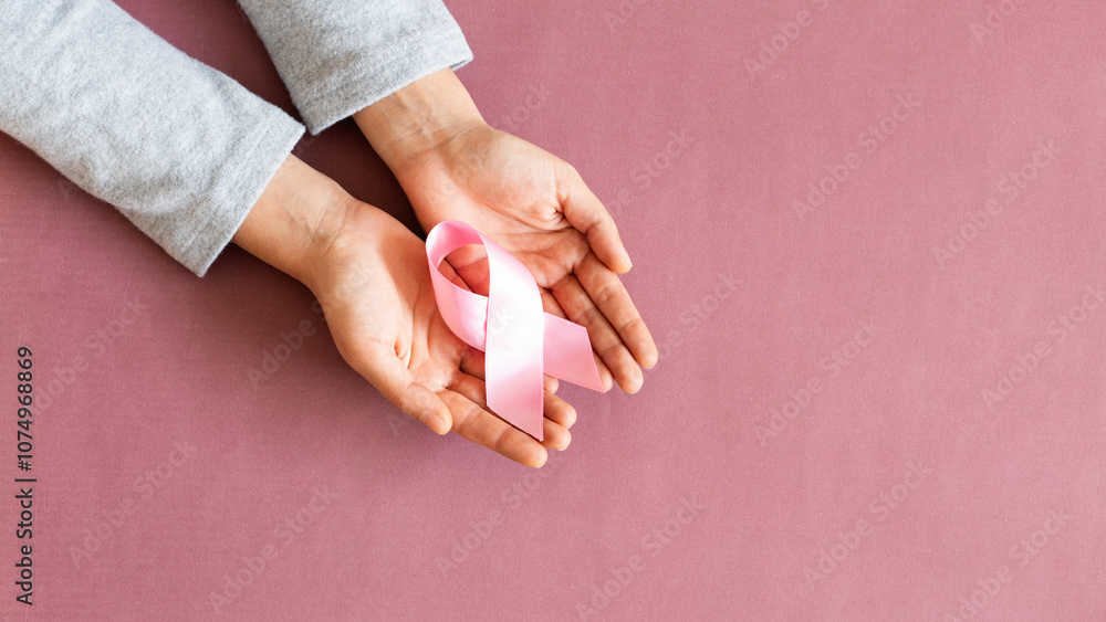 Supporting Breast Cancer awareness concept. Pink ribbon symbol for breast cancer. Supporting Breast Cancer awareness concept. Pink ribbon symbol for breast cancer.