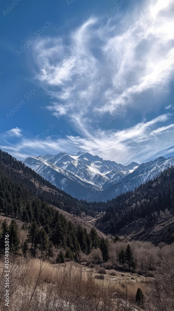 A breathtaking view of snow-capped mountains under a clear blue sky in the early morning light, surrounded by lush evergreen forests A breathtaking view of snow-capped mountains under a clear blue sky in the early morning light, surrounded by lush evergreen forests