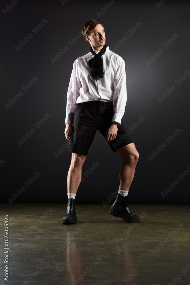 A stylishly dapper figure poses confidently against a dark backdrop in a contemporary setting A stylishly dapper figure poses confidently against a dark backdrop in a contemporary setting