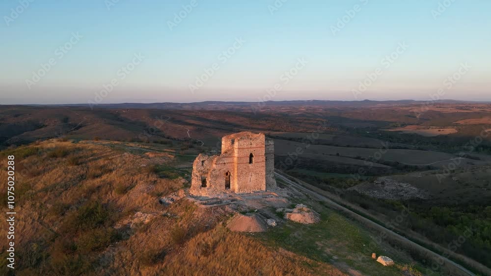 View of an ancient fortress at sunset View of an ancient fortress at sunset