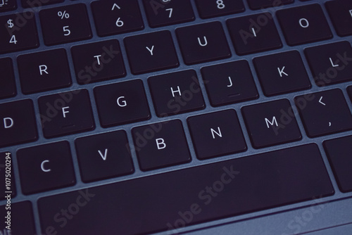 Close-up view of a laptop keyboard, showcasing the precise arrangement of keys.