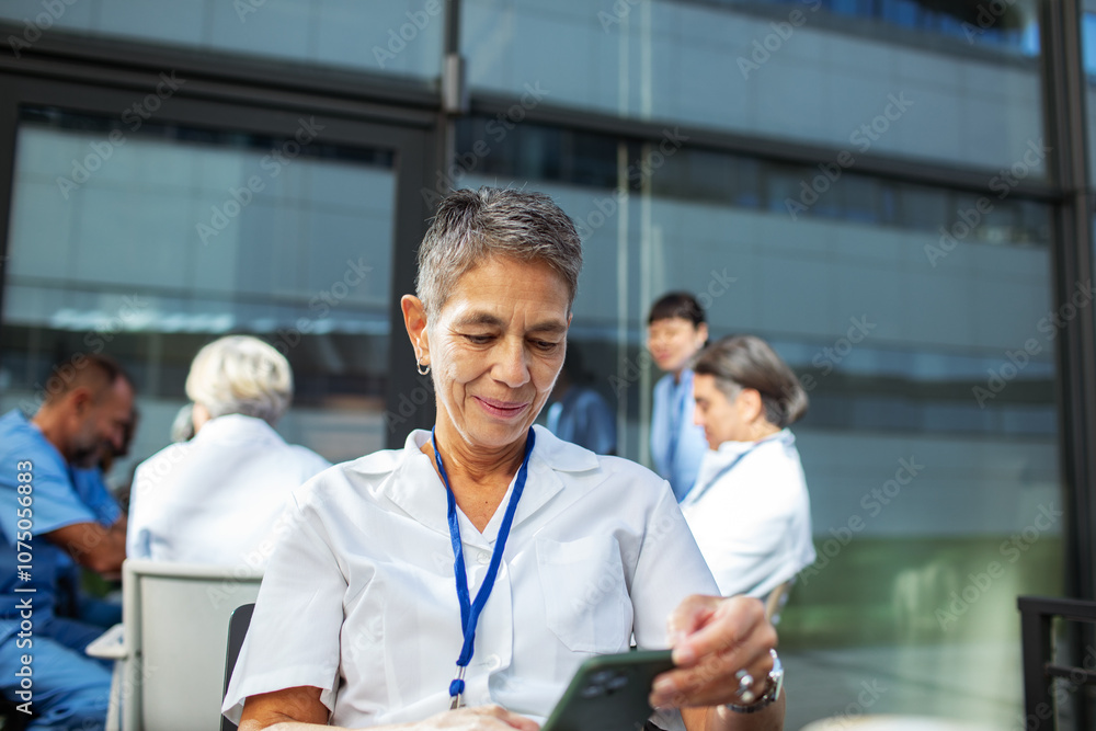 Medical nurse using smartphone on break Medical nurse using smartphone on break