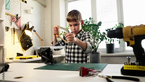 Wallpaper Mural Child performs tasks in workshop, facing safety risks and inappropriate expectations. Focus is on the exploitation of child labor, lack of proper supervision, and risks to health and development. Torontodigital.ca