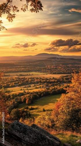 A tranquil view of Mount Greylock at sunset showcasing vibrant foliage and expansive valleys in autumn's embrace