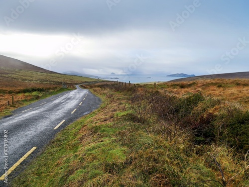 Deserted lonely road through Irelands coastal hill area on a autumn day