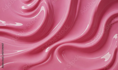 A close-up of pink, glossy liquid swirled into abstract patterns