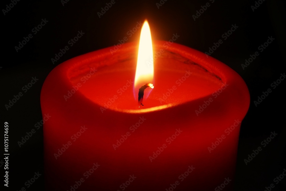 Red candle light sparkle and shine on dark background Red candle light sparkle and shine on dark background