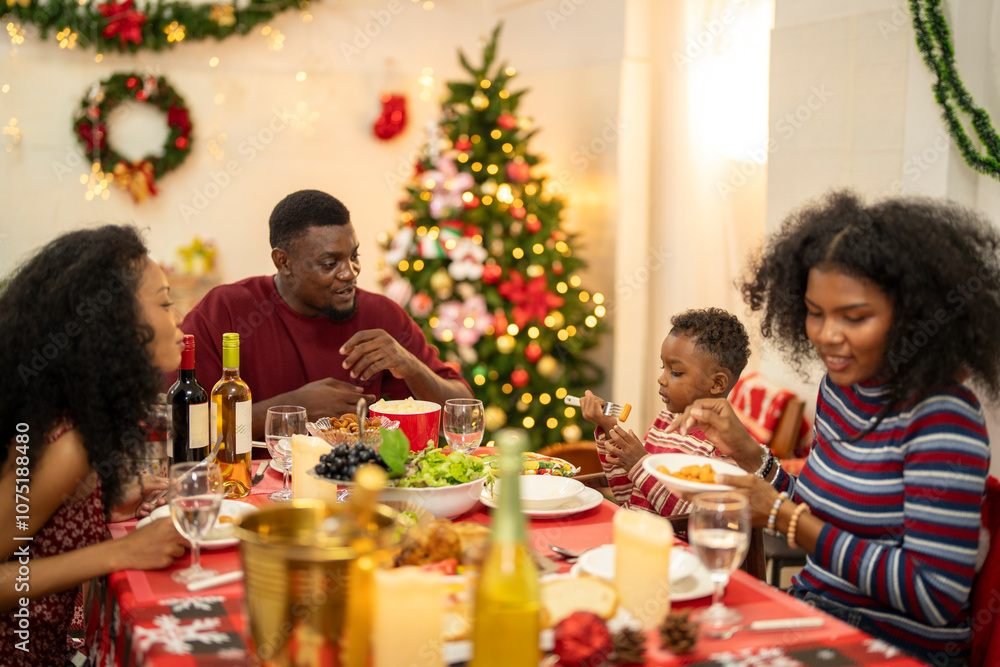 A warm Christmas family dinner with a father serving food to his young child, surrounded by festive decorations, a Christmas tree, and a holiday table spread. Joyful and cozy holiday atmosphere. A warm Christmas family dinner with a father serving food to his young child, surrounded by festive decorations, a Christmas tree, and a holiday table spread. Joyful and cozy holiday atmosphere.
