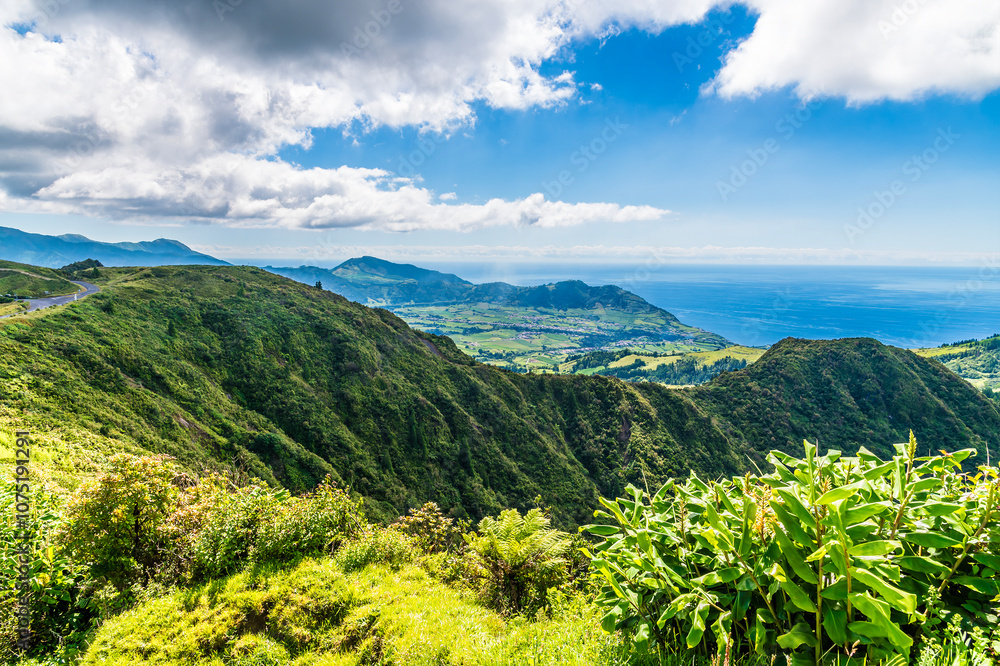 Fototapeta premium A view across the eastern rim of the Furnas Caldera on the island of Sao Miguel in the Azores in summertime
