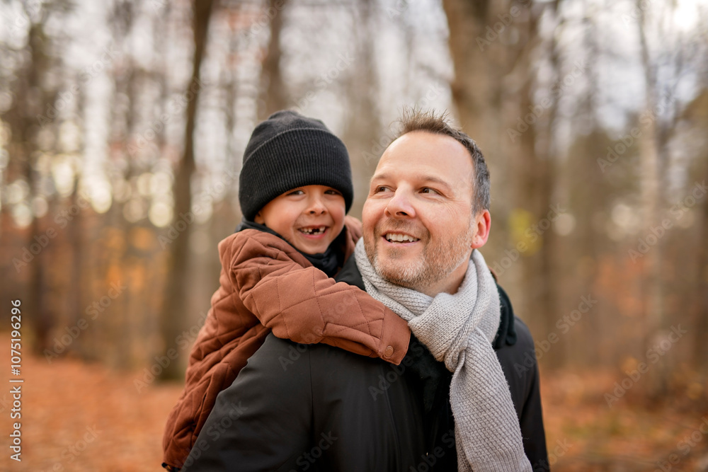 Joyful dad and his child boy. daddy and child have fun, laugh and enjoy nature outdoors at autumn park. Joyful dad and his child boy. daddy and child have fun, laugh and enjoy nature outdoors at autumn park.