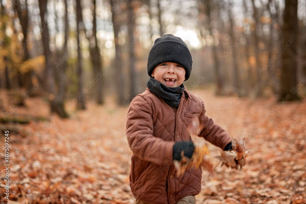Child boy having fun on Autumn Forest Child boy having fun on Autumn Forest