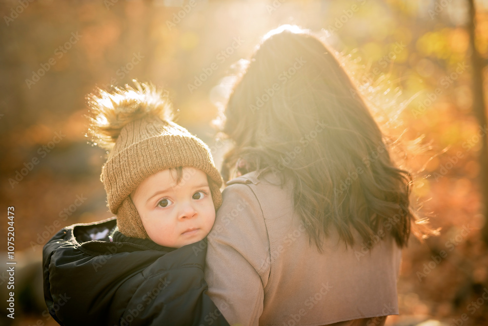 Joyful mother and his little baby. mother and child have fun, laugh and enjoy nature outdoors at autumn park. Joyful mother and his little baby. mother and child have fun, laugh and enjoy nature outdoors at autumn park.