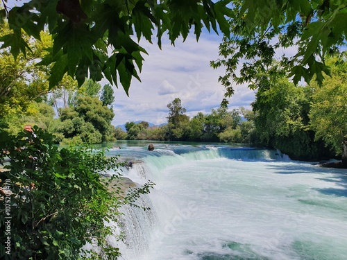 thourgh foliage Manavgat Waterfall 