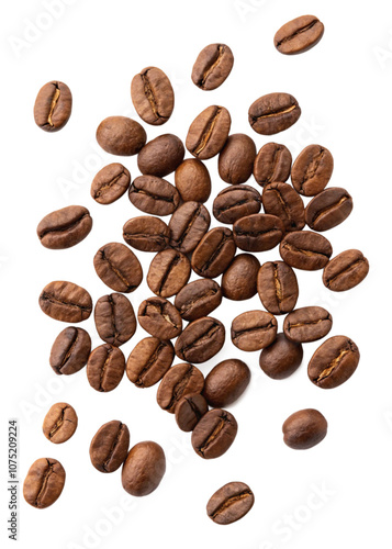 A collection of roasted coffee beans scattered on a white background.

