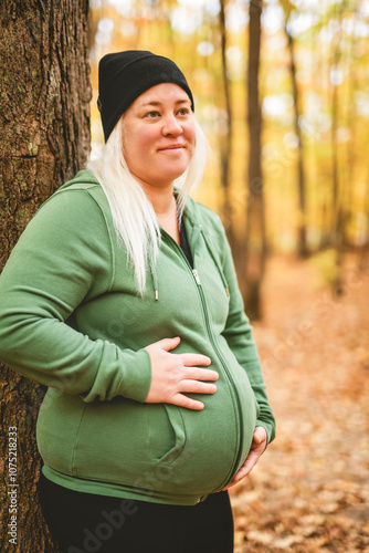 Nice Leabian pregnant woman in autumn park photo