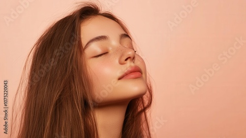 Girl with long hair, closed eyes, enjoying the moment with soft side lighting